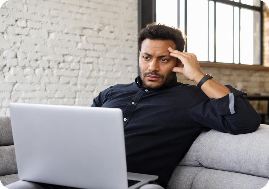 Business owner looking frustrated at his laptop